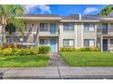 Beautiful condo building with well-kept lawns, stairs to upper units, and lovely doors at 7866 Eagle Creek Dr # 7866, Sarasota, FL 34243
