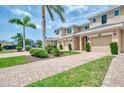 Inviting two-story townhomes with brick driveways, lush landscaping and well maintained exteriors at 8417 Karpeal Dr # 4, Sarasota, FL 34238