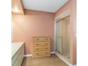 Bathroom with a tiled shower, a wooden dresser, and a white vanity, offering ample storage at 1163 Nantucket Rd, Venice, FL 34293