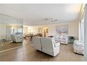 Bright living room with hardwood floors, a ceiling fan and lots of space for relaxing and entertaining at 1163 Nantucket Rd, Venice, FL 34293