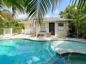 The pool and spa combo is perfect for relaxation and entertainment, complete with patio furniture at 152 Coolidge Dr, Sarasota, FL 34236
