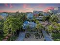 A beautiful property with lush tropical landscaping and views of the surrounding cityscape at 160 Coolidge Dr, Sarasota, FL 34236
