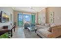 Comfortable living room featuring neutral tones, tile flooring and large windows to enjoy a gorgeous view at 1771 Ringling Blvd # 1206, Sarasota, FL 34236