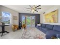 Bright living room with a balcony, chic furniture, and large windows offering scenic views at 1921 Monte Carlo Dr # 302, Sarasota, FL 34231