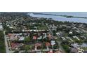 Aerial view showcases the home's location in a residential community near the water at 205 Sugarloaf Dr, Nokomis, FL 34275