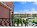 Balcony view of the waterfront condos, lush landscaping, and private boat docks at 2741 Via Cipriani # 935A, Clearwater, FL 33764