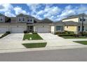 Well-kept exterior featuring a paver driveway, two-car garage and low maintenance landscaping at 3681 Divot Ln, Sarasota, FL 34232