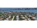 Panoramic aerial view showcases the property's location near the water and city skyline at 413 Partridge Cir, Sarasota, FL 34236
