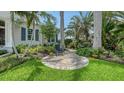 Secluded outdoor seating area surrounded by lush landscaping on the property's grounds at 413 Partridge Cir, Sarasota, FL 34236