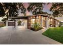 Beautiful home featuring a covered parking area, driveway, and well-manicured lawn at 4232 Pandora Rd, Venice, FL 34293