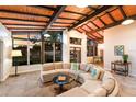 Bright living room with wood ceilings, neutral palette, and large windows at 4232 Pandora Rd, Venice, FL 34293