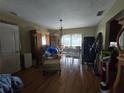 This spacious dining room features wood floors, lots of natural light, and an open floor plan at 4343 Arrow Ave, Sarasota, FL 34232