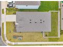 Aerial view of the house showing the roof, yard and driveway at 4405 Weathered Moss Gln, Palmetto, FL 34221