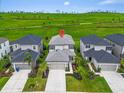 Gorgeous aerial view of the home with lush green space and manicured landscaping at 5540 Summit Gln, Bradenton, FL 34203