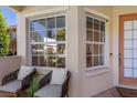 Cozy front porch area with comfortable seating and plenty of natural light at 7419 Birds Eye Ter, Bradenton, FL 34203
