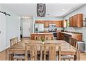 Open-concept kitchen boasts stainless steel appliances and a large dining table at 1107 22Nd E St, Palmetto, FL 34221