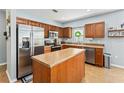 Well-equipped kitchen with stainless steel appliances, island, and abundant counter space at 1107 22Nd E St, Palmetto, FL 34221