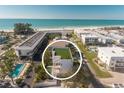 Aerial view of a beachfront property showcasing its proximity to the beach at 111 6Th N St, Bradenton Beach, FL 34217