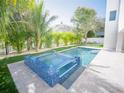 Outdoor pool and spa area featuring palm trees at 111 6Th N St, Bradenton Beach, FL 34217