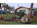 Beautiful Florida home enhanced by gorgeous, tropical landscaping at 134 Gulfview Rd, Punta Gorda, FL 33950