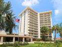 Elegant high-rise condominium boasting multiple balconies, lush landscaping, and a prime location at 2295 Gulf Of Mexico Dr # 64S, Longboat Key, FL 34228