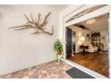 Inviting entryway with decorative wall art and a view into the bright, open living space at 2381 Appaloosa Cir, Sarasota, FL 34240