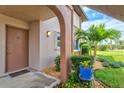 Inviting condo entrance with well-kept landscaping and a welcoming atmosphere at 25100 Sandhill Blvd # 104 G, Punta Gorda, FL 33983