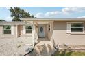 Charming home with neutral siding, decorative stone, and well-manicured landscaping at 4330 Alligator Dr, Venice, FL 34293