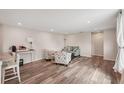 Open living room with comfortable seating, updated flooring, and a stylish decor at 4330 Alligator Dr, Venice, FL 34293