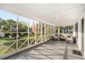 Bright screened patio with comfortable seating, offering a relaxing outdoor living space and backyard view at 520 27Th W St, Bradenton, FL 34205