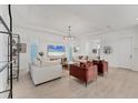 Spacious living room with modern lighting, stylish furniture, and an open-concept design at 6028 Red Mangrove Ln, Bradenton, FL 34210