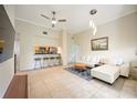 Inviting living room featuring tile floors, open access to the kitchen, and comfortable modern seating at 1064 N Tamiami Trl # 1125, Sarasota, FL 34236