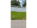 White fence with green grass on a sunny day at 11707 104Th St, Largo, FL 33773