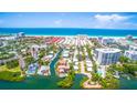 Breathtaking aerial view showcasing pristine beaches and waterfront homes with boating access at 1240 Solitude Ln, Sarasota, FL 34242