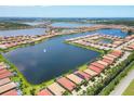 Expansive aerial view showcases a residential community with multiple lakes and well-maintained homes at 201 Vinadio Blvd, Nokomis, FL 34275