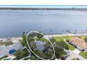 Aerial view of waterfront property with lush landscaping and mature trees at 2401 Riverview Blvd, Bradenton, FL 34205