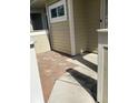 Cozy patio area with brick flooring, ideal for outdoor relaxation and enjoying the peaceful surroundings at 3032 Heron Lake Ct # 7B, Venice, FL 34293