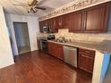 Well-equipped kitchen with stainless steel appliances and wood cabinets, offering both style and functionality at 4199 66Th Street W Cir # 4199, Bradenton, FL 34209