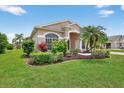 Charming single-story home with well-manicured lawn and mature tropical landscaping at 4531 Useppa Dr, Bradenton, FL 34203
