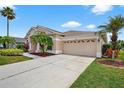 Beautiful single-story home with a large garage and well-maintained front yard landscaping at 4531 Useppa Dr, Bradenton, FL 34203