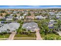 Aerial view of a beautiful home with lush landscaping in a desirable neighborhood at 4727 Starboard Dr, Bradenton, FL 34208