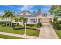Inviting home boasting manicured landscaping, mature trees, and attached garage at 4727 Starboard Dr, Bradenton, FL 34208