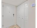 Neutral entry area features a door and closet space at 6265 Midnight Pass Rd # 205, Sarasota, FL 34242