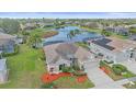 Beautiful aerial view of this home with lush backyard and water view at 6266 Buckingham St, Sarasota, FL 34238
