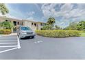 Well-maintained condo building with assigned parking space and beautiful green landscaping at 7110 Fairway Bend Ln # 181, Sarasota, FL 34243