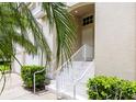 Inviting entrance with a well-maintained stairway and lush landscaping at 7137 Cedar Hollow Cir, Bradenton, FL 34203