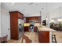 Well-appointed kitchen with stainless steel appliances, granite countertops, and custom cabinetry at 7716 Geneva Ln, Sarasota, FL 34243