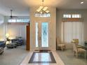Open entryway with decorative glass door and tile flooring at 8616 15Th Nw Ave, Bradenton, FL 34209