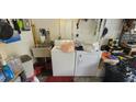 Functional laundry area with sink, washer, and dryer, offering convenience for household chores at 120 Sw Monroe N Cir, St Petersburg, FL 33703