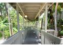 Exterior walkway winding through lush landscaping at 1347 Landings Dr # 6, Sarasota, FL 34231